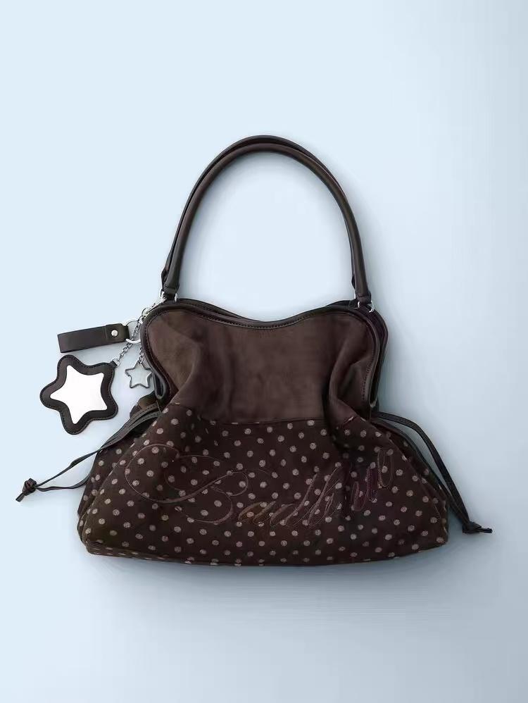 BadBlue, a Korean brand known for its niche, forest-inspired leopard print dot pattern, business-ready bag with a trendy, sweet-