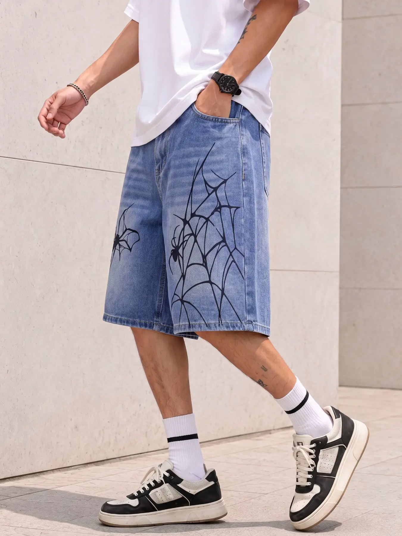 Men's washed loose denim shorts, featuring a spider print design, American street Y2K style, a versatile casual summer essential