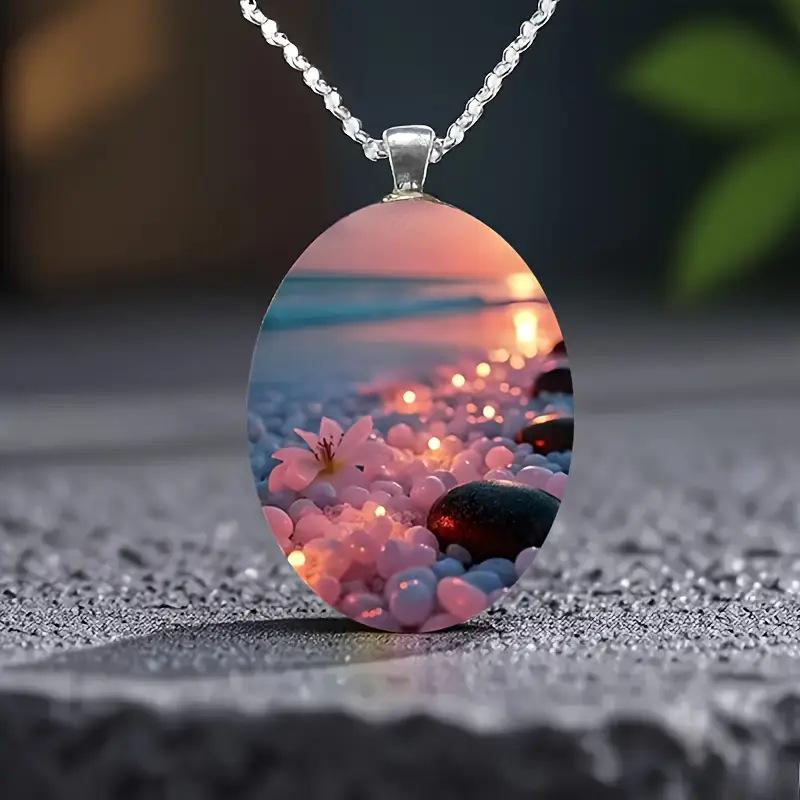 A beautiful summer beach ocean-themed oval-shaped silver alloy glass pendant and stainless steel chain