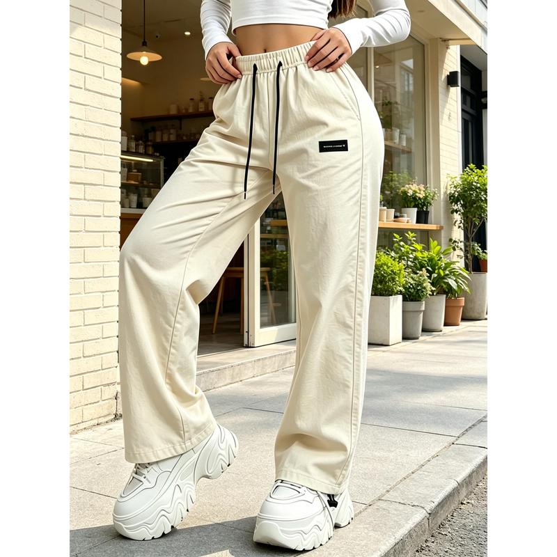 Women Relaxed Fit Street‑Style Wide Leg Pants, Elastic Drawstring Waist with Contrast Black Drawcords, Decorative Woven Label Detail, Adjustable Toggle Ankle Cuffs, Lightweight Wrinkle‑Resistant Casual Trousers, Versatile Daily Outfit for Street Fashion,
