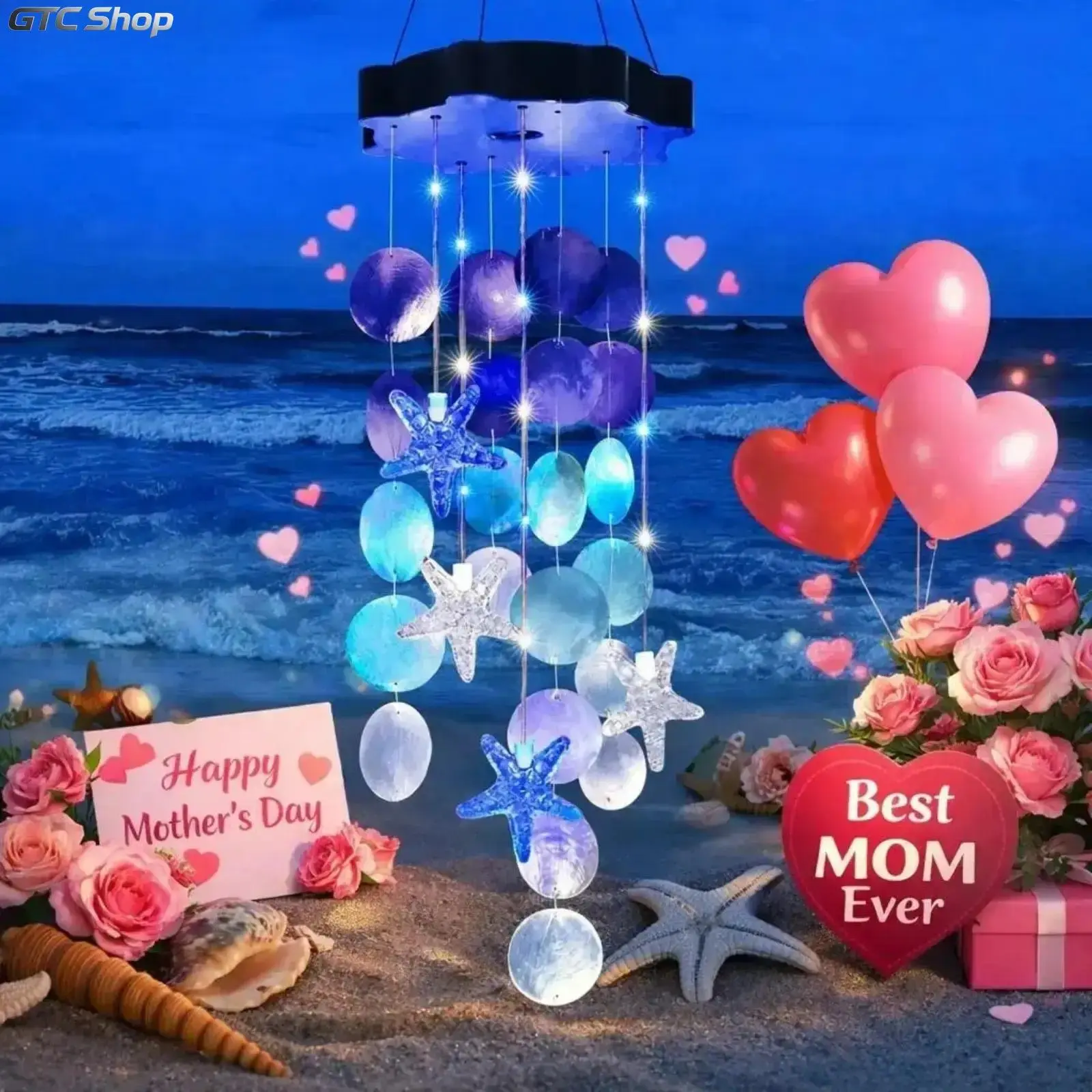 Solar Powered Seashell Wind Chime with Blue & White Starfish Lights, charming outdoor garden decor. Beautiful hanging ornament for yards and windows, ideal thoughtful Mother's Day gift for women.