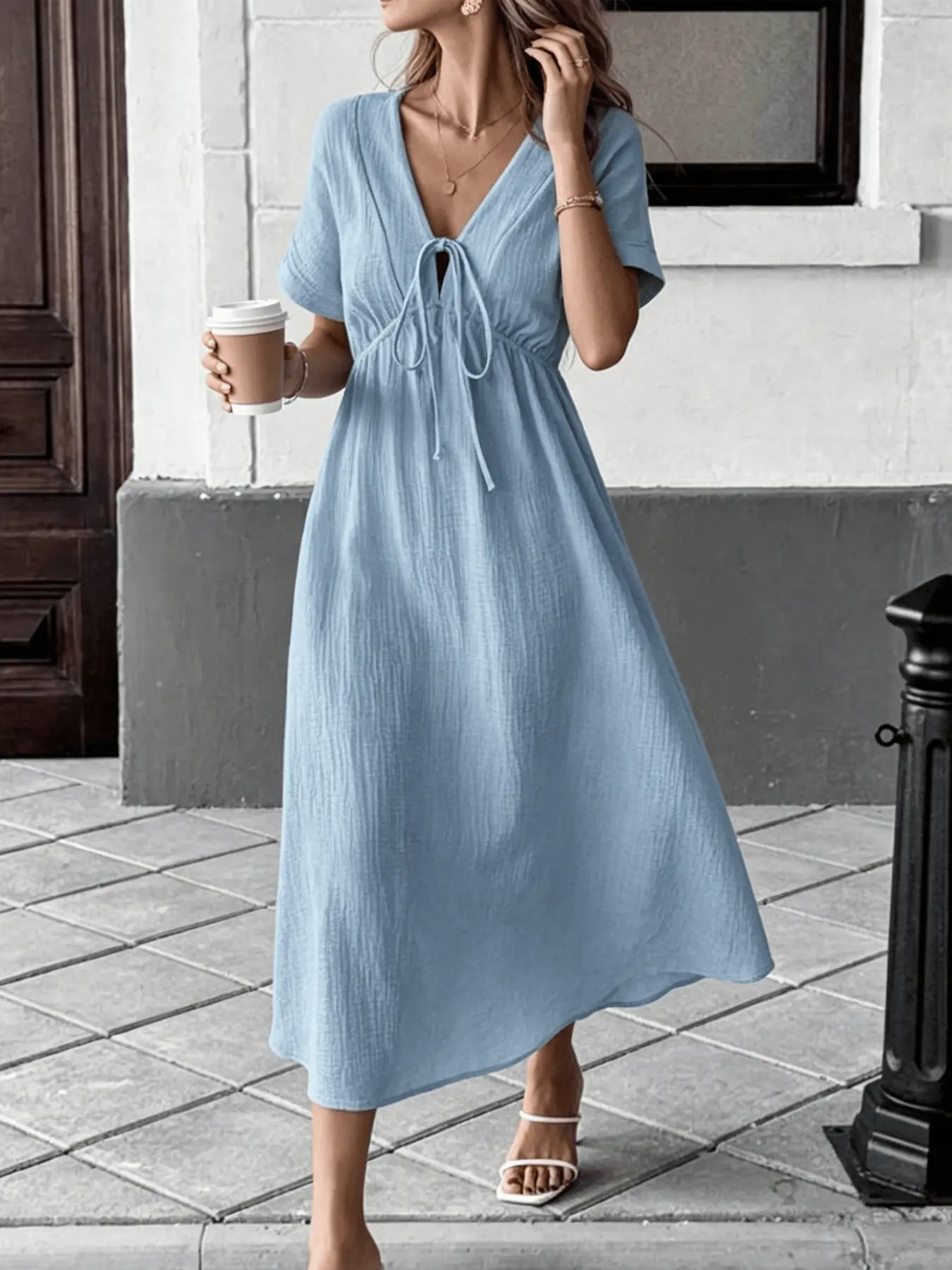 A women's fashionable casual resort-style pure-color dress with a V-neck, lace-up front, high waist, and large skirt, creating a slimming effect and a festive atmosphere. Ideal for summer, dating, parties, beach outings, and afternoon tea.