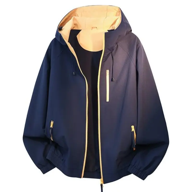 hooded windbreaker jacket, light beige inner lining, contrast golden zipper details, adjustable drawstring hood, multiple zippered pockets, elastic cuffs and hem, loose cropped silhouette, lightweight wind-resistant fabric, functional casual outerwear for