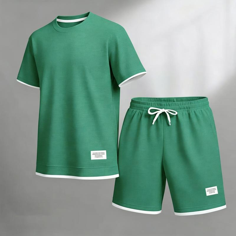 Breathable grid textured short sleeve tee and elastic waist loose knee shorts matching outfit, small label detail comfy silhouette, versatile easy-styling wardrobe set for laid-back street style and streamlined urban mensfashion