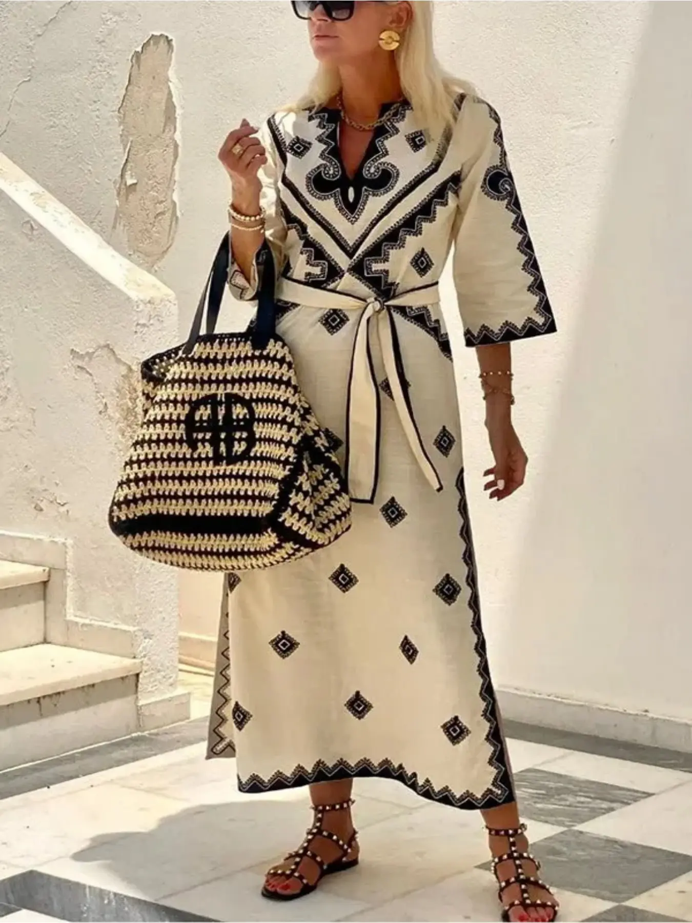 A serene, elegant, ethnic-print midi dress with a belted waist