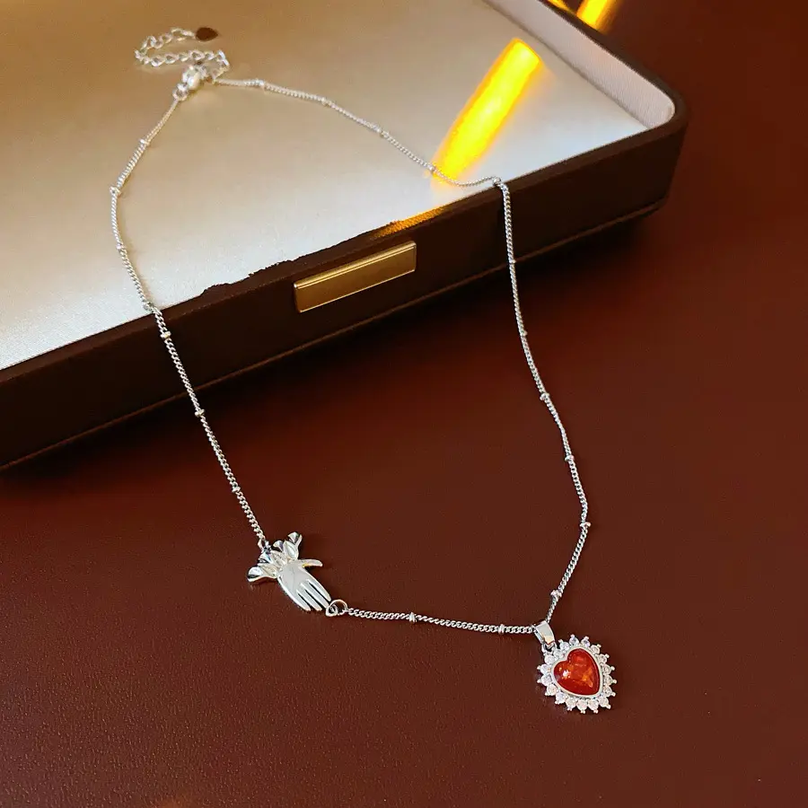 Women's Silver Heart Pendant Necklace: Exquisite short necklace featuring a red agate and crystal halo, a beaded chain, and a cross charm—a romantic jewelry gift for dates.