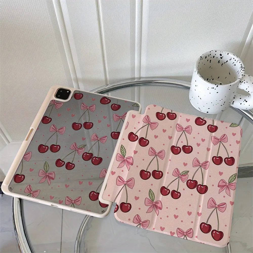 Pink bow and cherry pattern protective case featuring an adjustable stand and stylus holder; a foldable, non-slip TPU cover compatible with Samsung, iPad mini, iPad Air, iPad Pro, and iPad (10th/11th Gen) series.