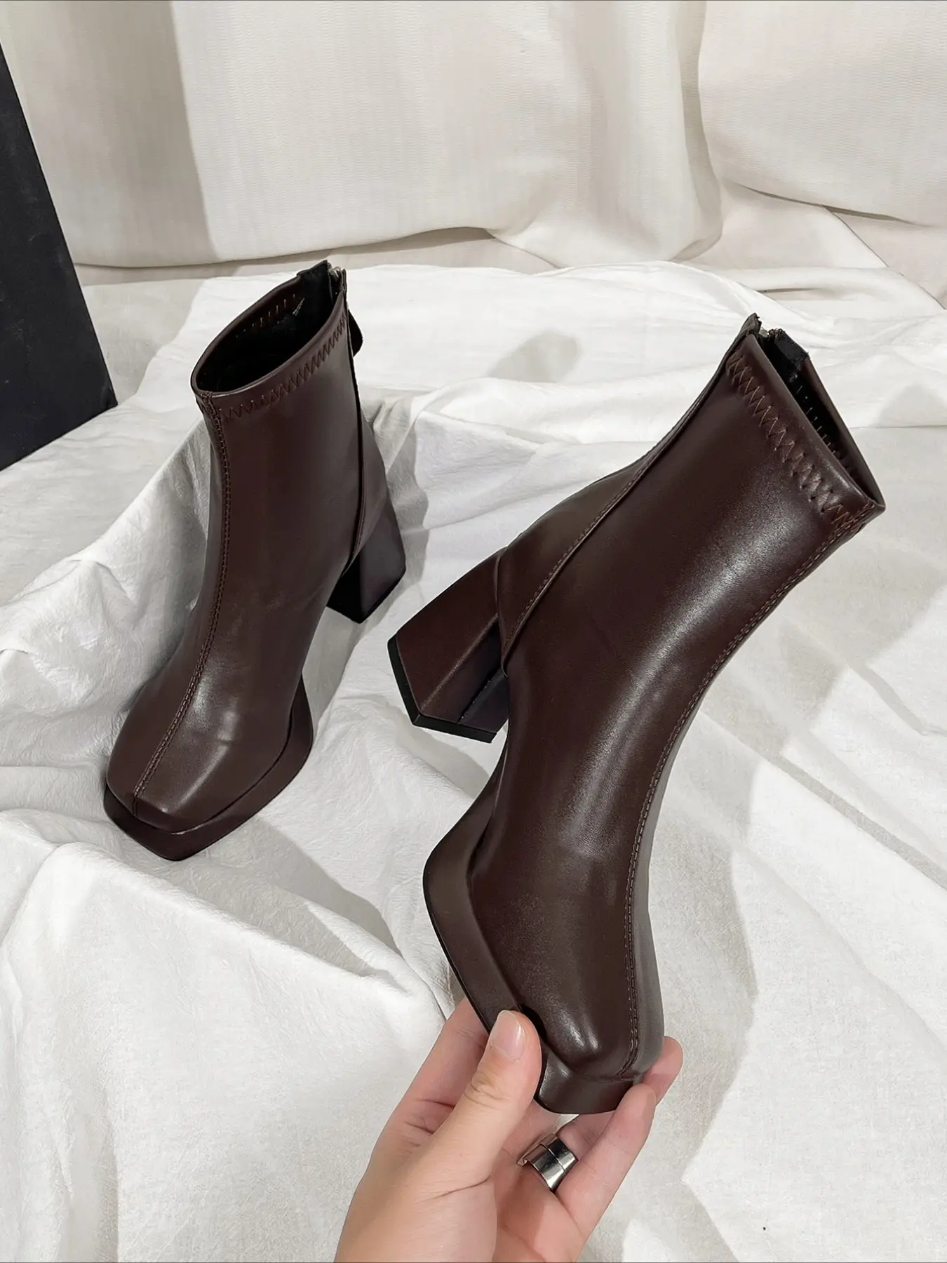 Square toe block heel ankle boots with platform and side zipper. Smooth leather, stylish women fashion boots for autumn and winter.