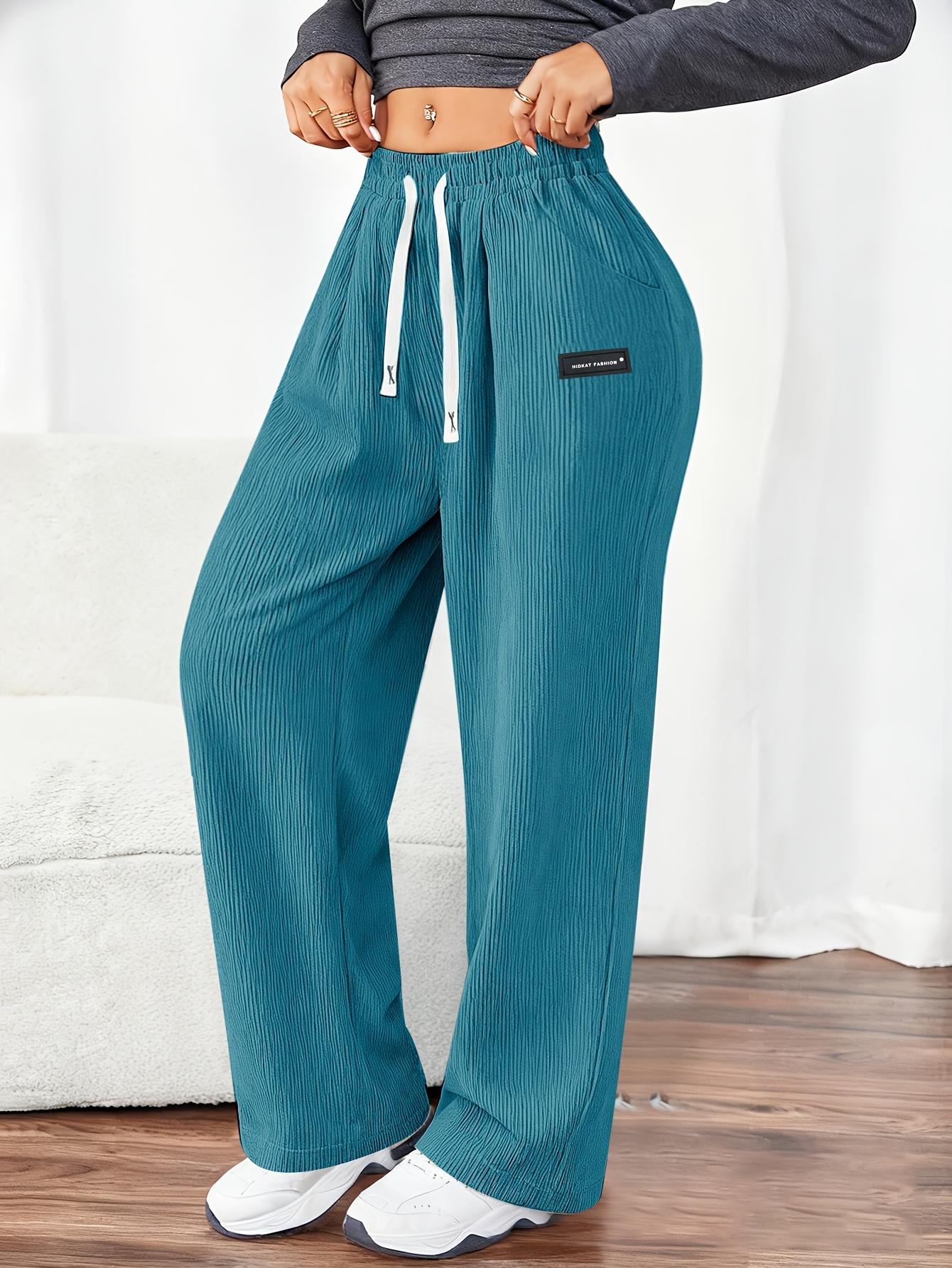 Women's Corduroy Jogger Pants for Spring and Autumn, featuring solid colors with drawstring pockets. Crafted from soft and comfortable fabric, these pants are ideal for everyday casual wear.