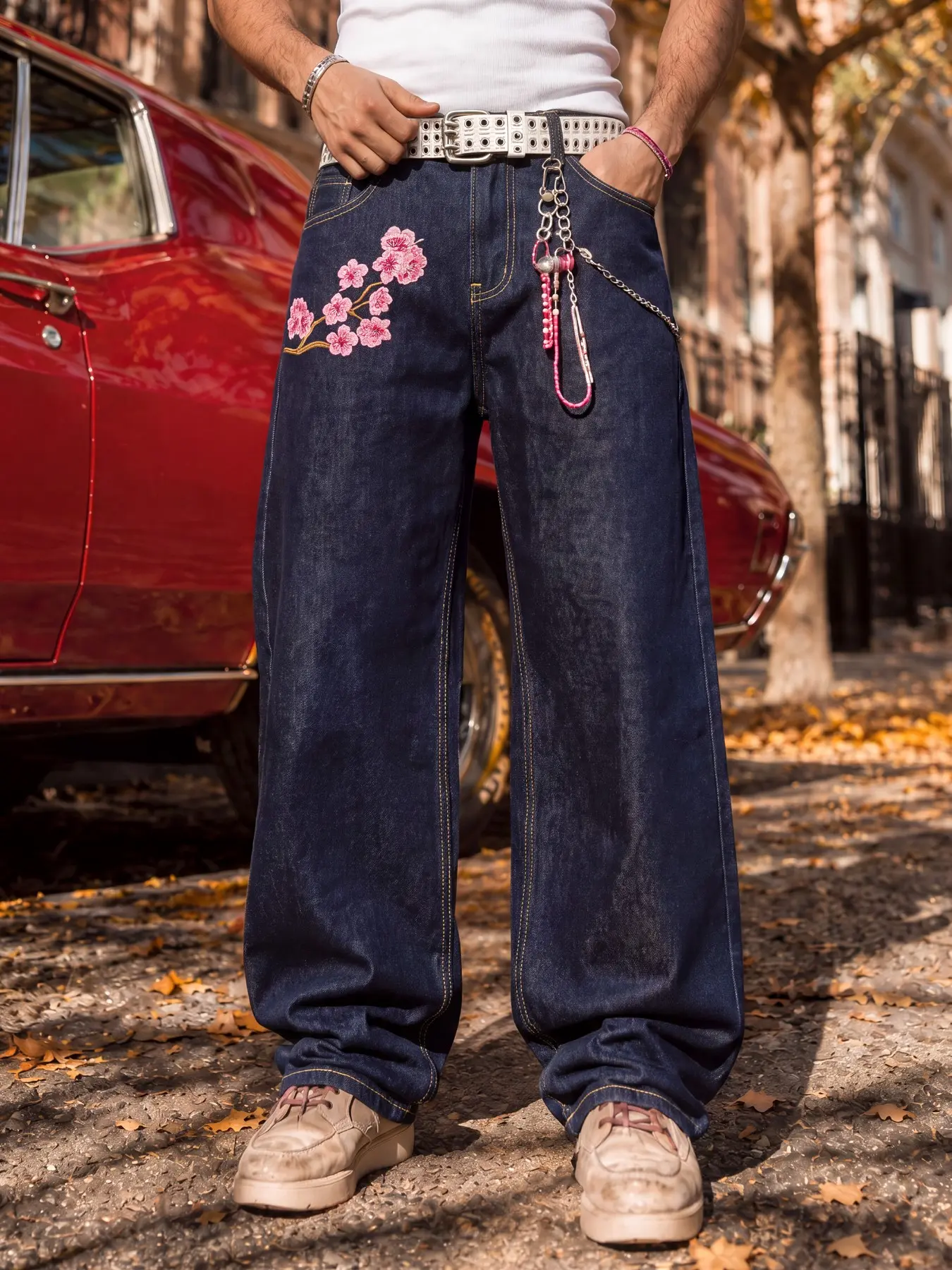 Men's loose wide-leg denim pants, loose wide-leg fit, featuring pink floral embroidery design, creating a premium American streetwear look