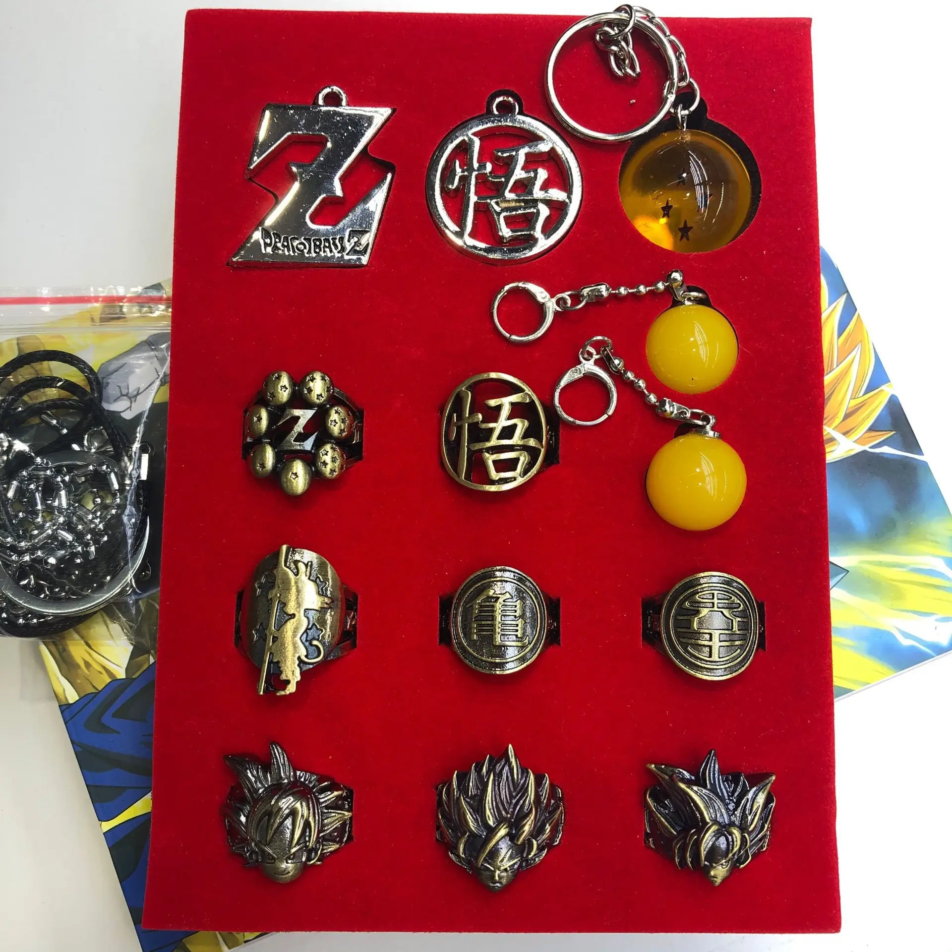 Dragon Ball Z Collectible Gift Box Set, DBZ Metal Rings, Dragon Ball Pendant Keychains, Z Symbol & Goku Logo Pendants, Super Saiyan Head Cosplay Rings, Anime Jewelry Accessory Pack for DBZ Fans Cosplay Collection