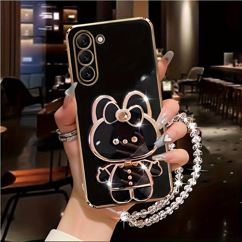 New rabbit-shaped adhesive phone stand with makeup mirror is suitable for iPhone, Samsung, Xiaomi phones, and various other phones. The rabbit phone case desktop stand is a hollow-out lazy stand