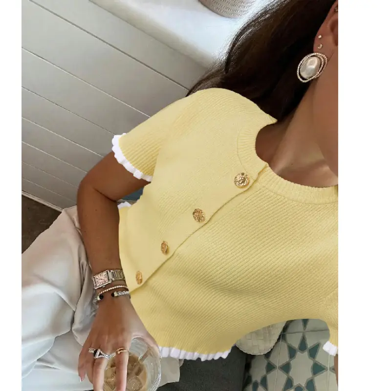 This cream button-detail knit top gives elegant halter neck dress energy when paired with a flowy maxi skirt 👀 ✨