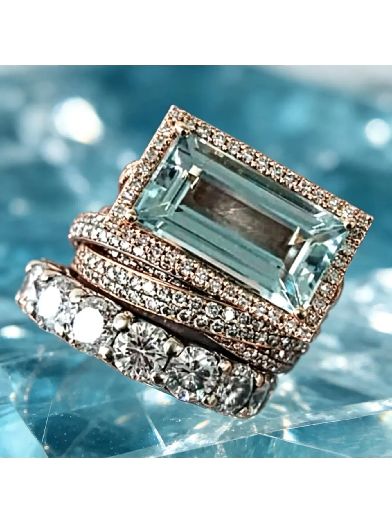 Light blue rectangular main stone set with three layers of interlocking ring bands. Retro multi-ring combination ring with mixed colors. Luxurious yet casual accessory for weddings and daily life.