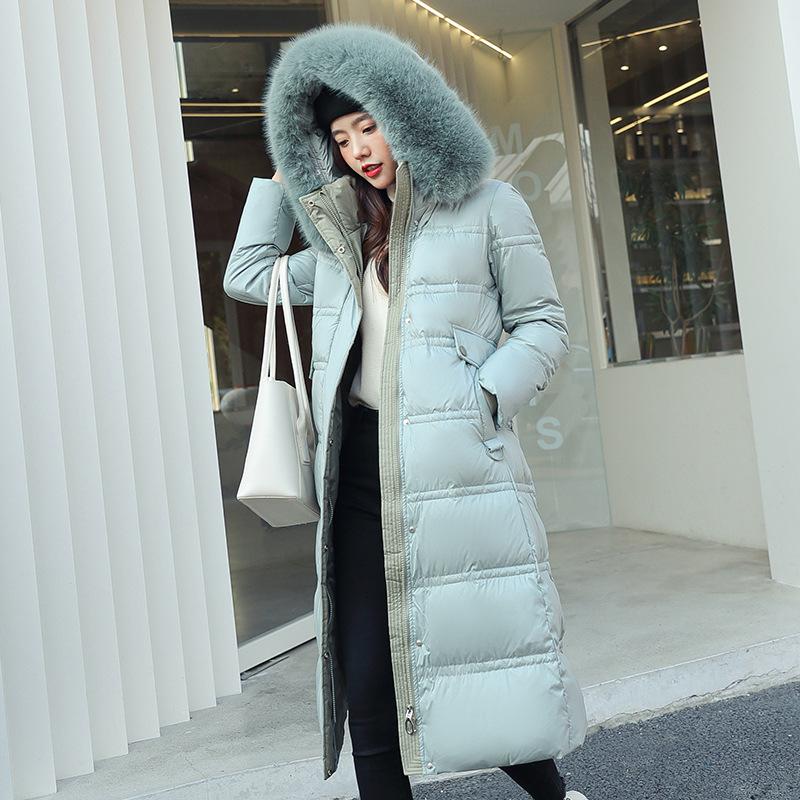 New winter women's thickened long over-the-knee hooded cotton-padded coat with large fur collar. New winter women's thickened long over-the-knee hooded cotton-padded coat with large fur collar.