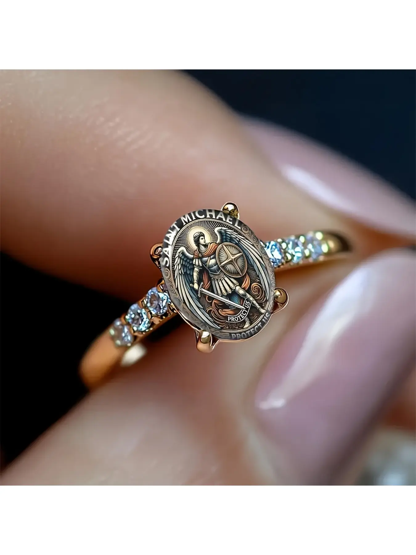 The Saint Michael Angel Diamond Rose Gold Ring features a vintage-style illustration of Saint Michael holding a sword. The surrounding text conveys the meaning of protection. Large diamonds are set on both sides, making it a truly majestic piece that is p