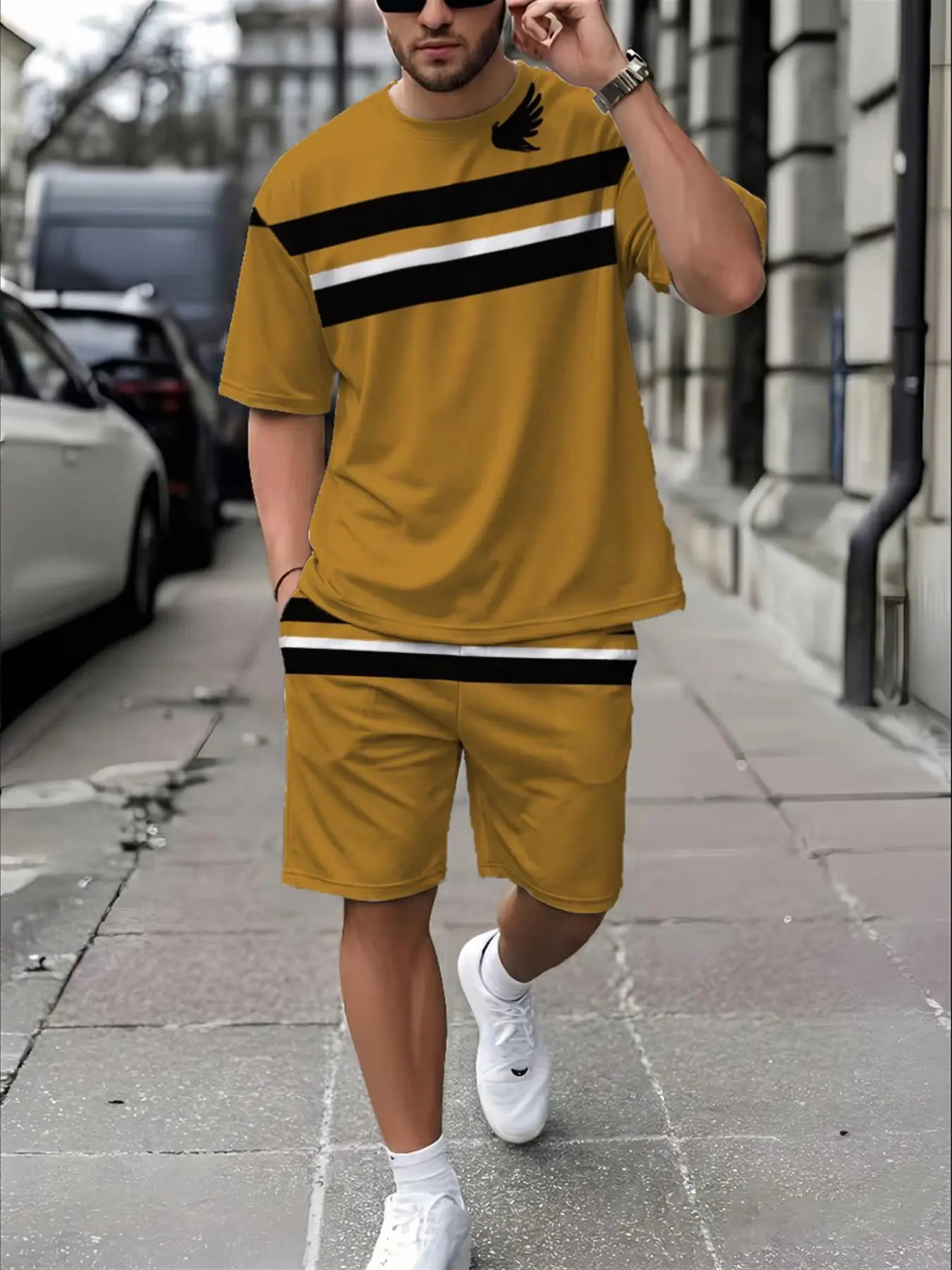 Men's casual summer two-piece set: a mustard yellow short-sleeved t-shirt and shorts, featuring a striped pattern and simple wing elements. Made from lightweight and breathable fabric, it's suitable for street style and outdoor leisure.