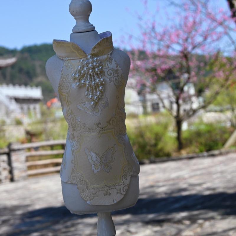 Paws Trendy Pet Spring & Summer Qipao for Dogs & Cats, suitable for Teddy, Bichon Frise and other small dogs. Features embossed fabric with exquisite retro frog buttons, fine workmanship, exuding noble elegance and making your beloved pet stand out.