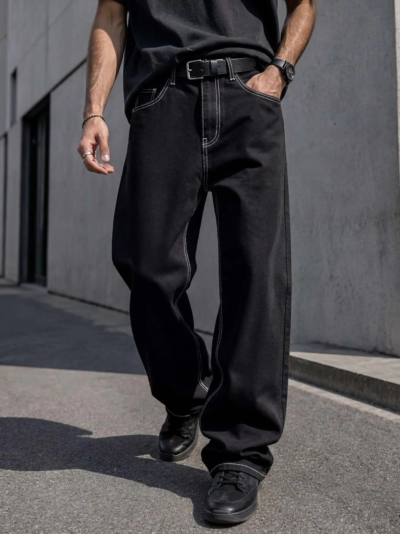 Men’s black denim jeans Vintage, draped wide-leg loose fit with dark denim body and white stitch structure, retro skate laid-back silhouette