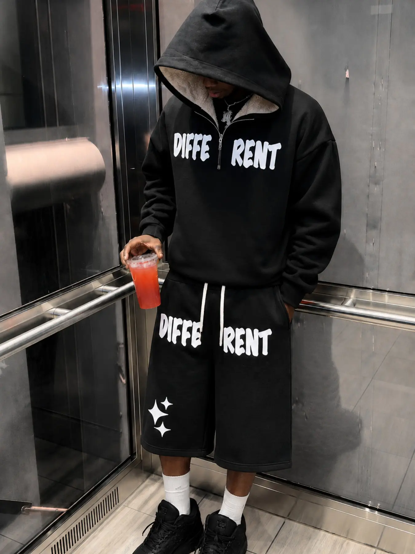 Men's Black Graphic Hoodie and Bermuda Shorts Set, Oversized Pullover with White Slogan and Star Prints, Knee-Length Wide-Leg Drawstring Shorts, Retro Y2K Streetwear Outfit for Campus, Skate Looks, Travel, Casual Weekends, and Hip Hop Styling