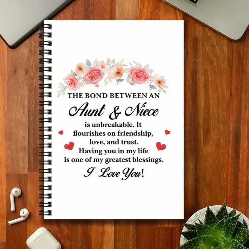 A family commemorative spiral notebook, Spiral Bound Notebook inscribed with "The bond between an aunt and a niece is unbreakable, it thrives in friendship, love, and trust; having you in my life is one of my greatest blessings. I love you!"