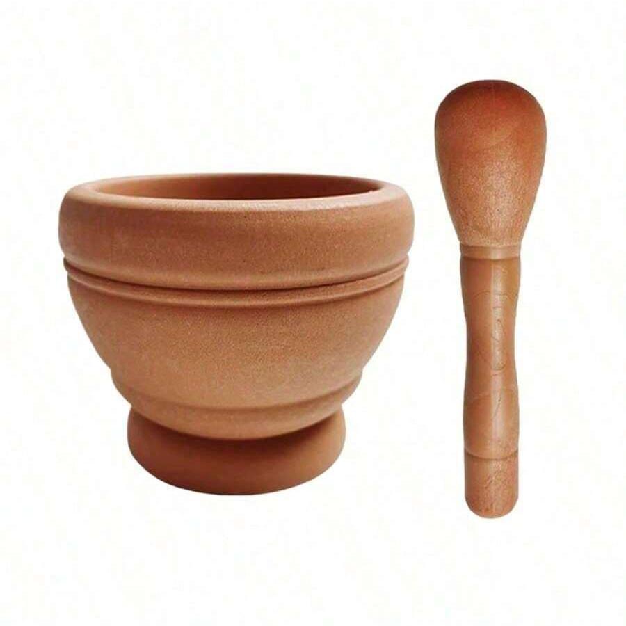 A practical garlic grinder with a mortar, a multi-functional manual food grinder, a kitchen crushing tool, a household garlic grinder, and a spice tool