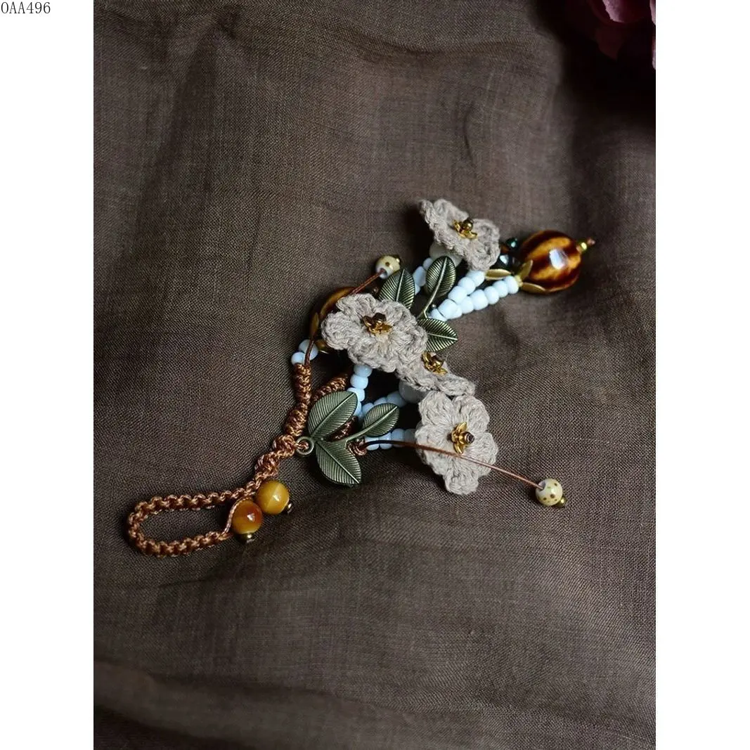 Vintage Forest Woven Milk Foam Coffee Flower Pendant Keychain, delicate floral handmade charm works as car key holder and cheongsam front placket ornament. Soft pastoral aesthetic decorative accessory for daily outfits, bags and vehicle keys.