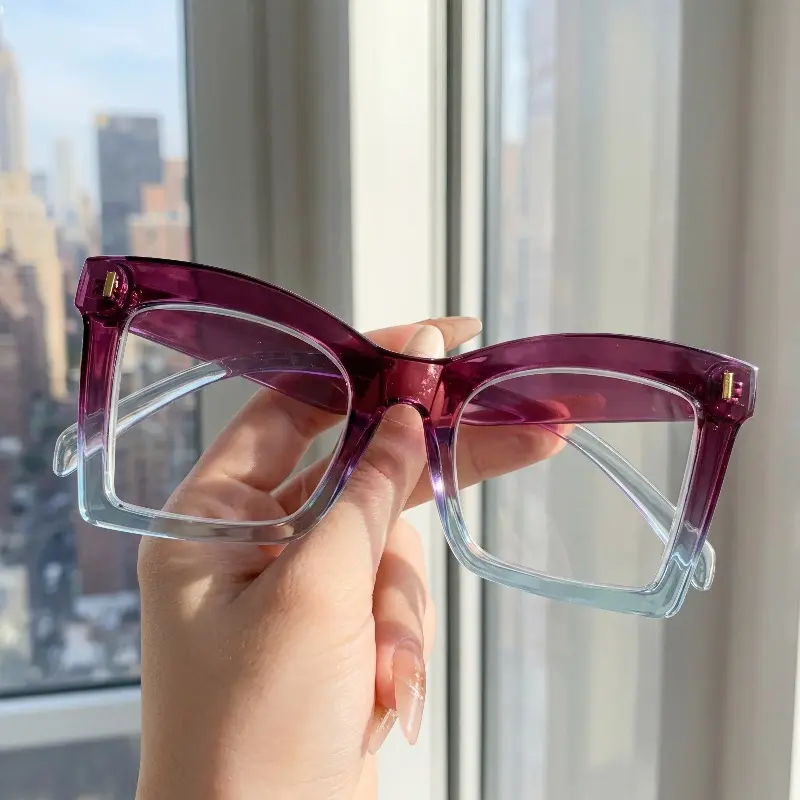Stylish women's cat-eye reading glasses featuring a vintage black frame with gold accents, blue light blocking, and a full-frame design—a perfect gift for seniors.
