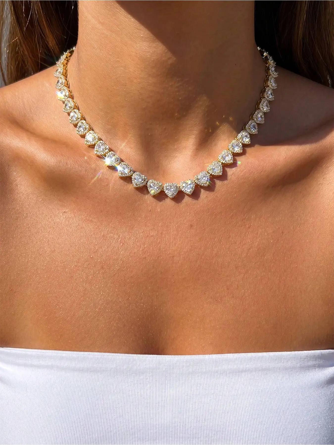 A sweet and playful sparkling heart-shaped crystal halo necklace is a gorgeous accessory for girls to wear at proms and parties.