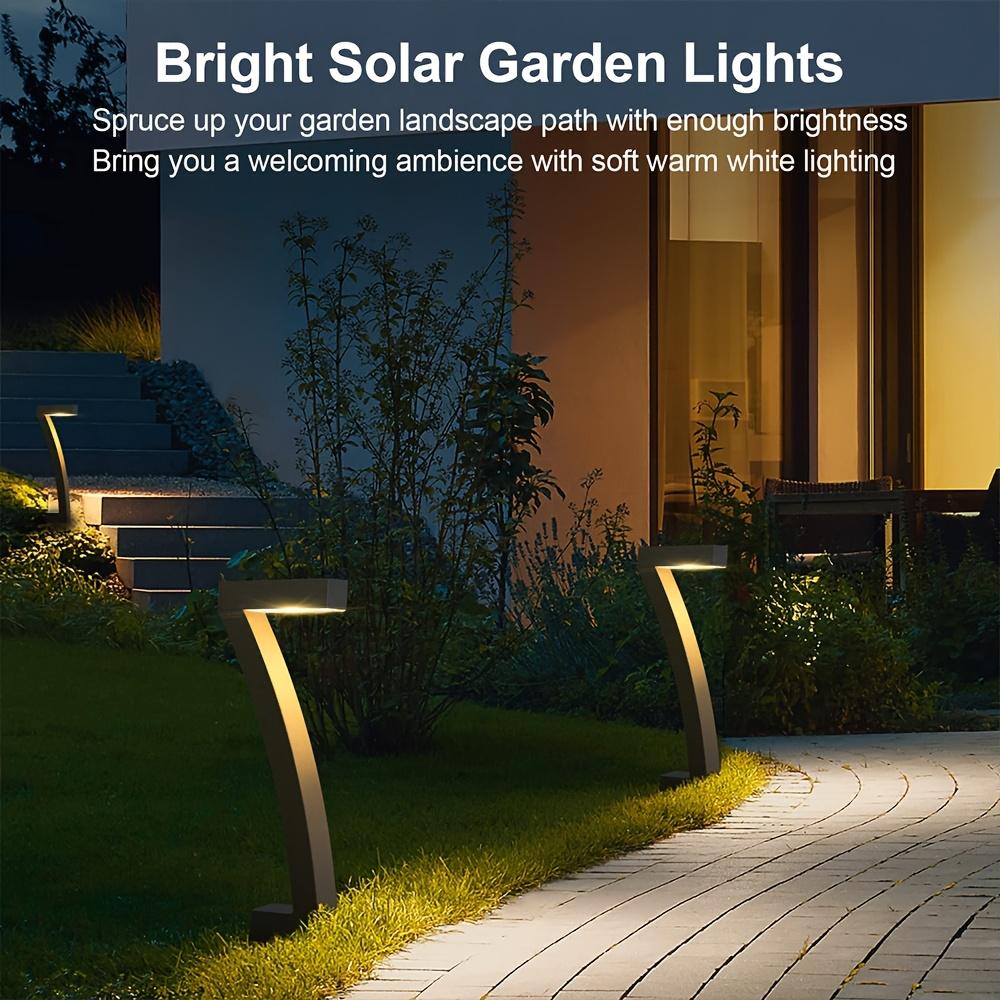 4-pack solar lights for outdoor walkways, upgraded bright LED outdoor solar lights, suitable for outdoor use, IP65 waterproof solar garden lights, suitable for courtyards, driveways, walkways, landscaping, and courtyard decoration.