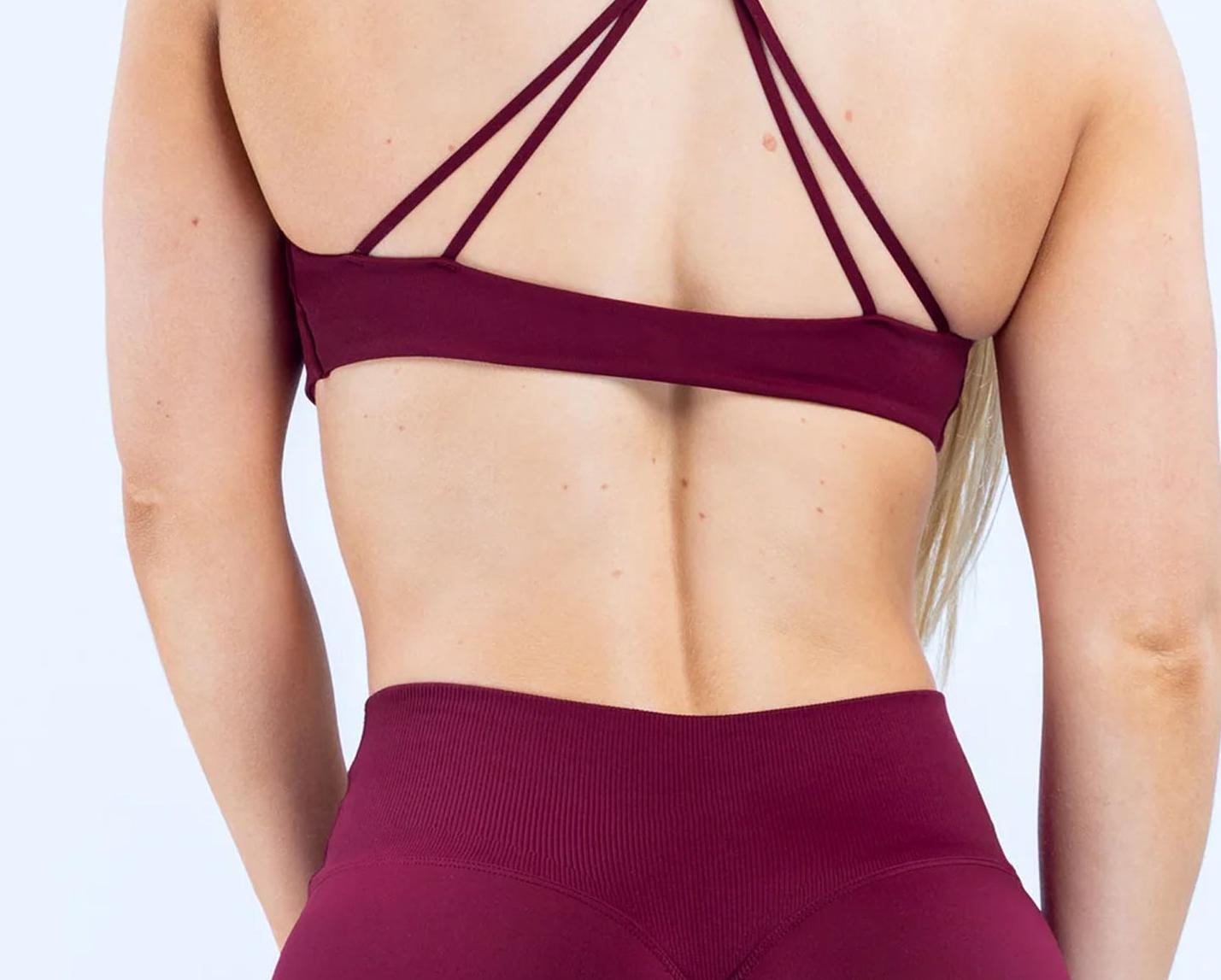 DFYNE Seamless Thin Strap Bandeau Top |   Front twisted back design for a supportive and flattering look, high elasticity and skin-friendly fabric that won't dig into your shoulders, providing a bare-skin feel during exercise.