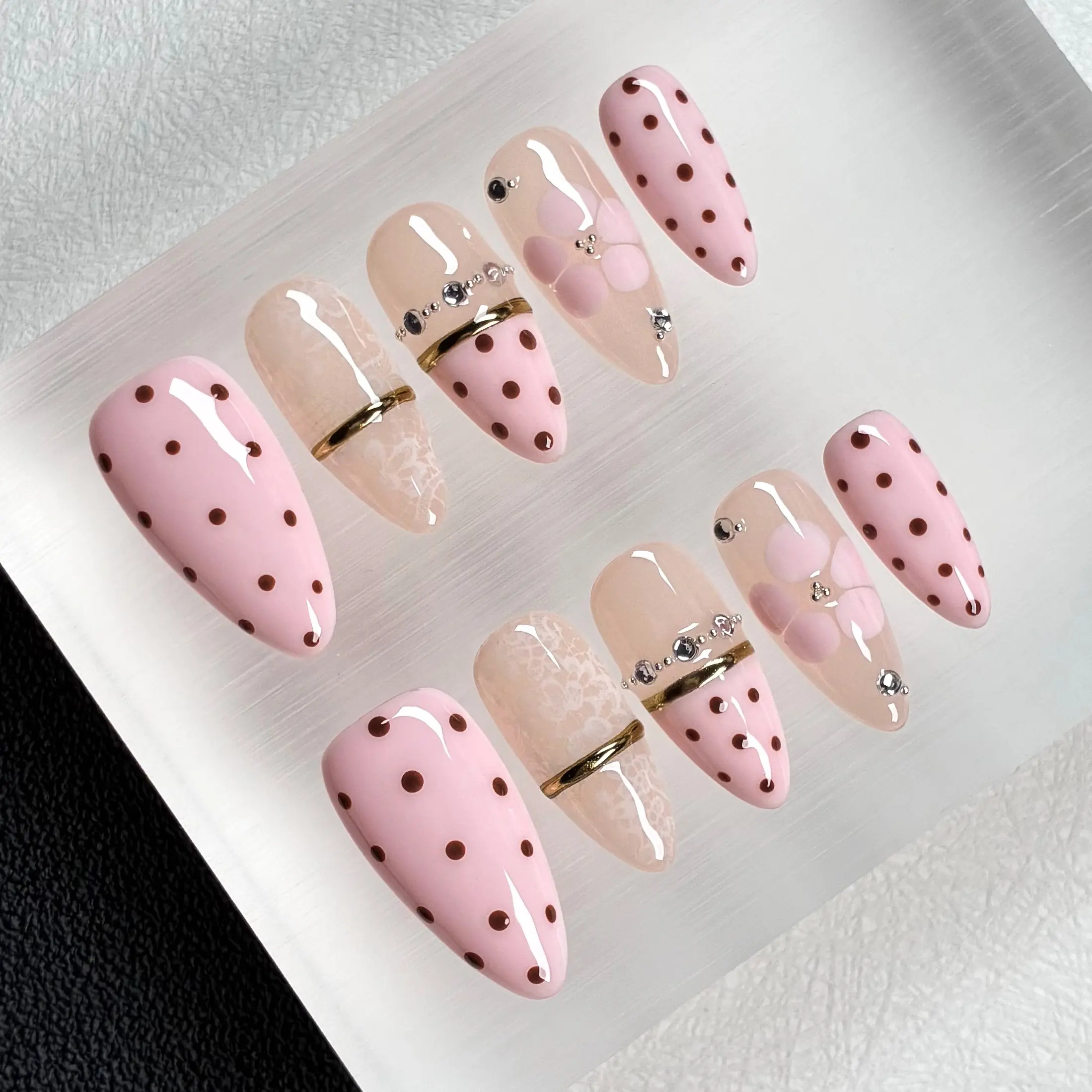 Coquette Pink Polka Dot Lace Press On Nails, Decorative Nails, Acrylic Press On, Medium Almond, 10pcs Glossy nails with brown polka dots, sheer lace, 3D pink flowers, gold strips & rhinestone chains, ideal for garden picnics, coffee dates, reusable
