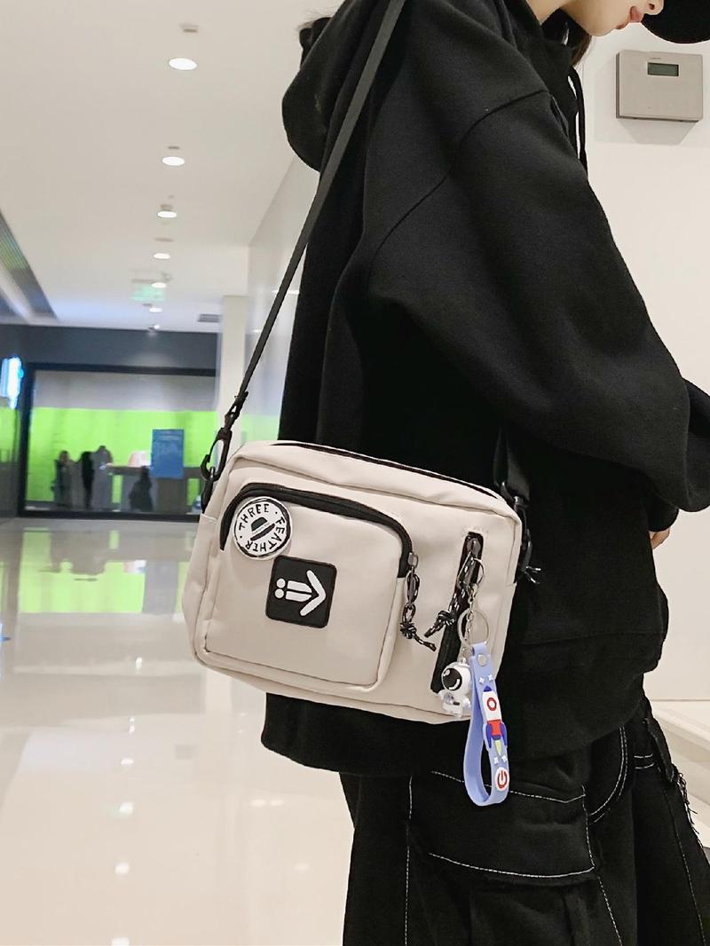 Unisex Casual Plain Color Release Buckle Crossbody Bag with Astronaut Charm, Fashionable Versatile Zipper Crossbody Bag with Random Color Badge, Trendy Shoulder Bag for Daily Use, Adjustable Crossbody Bag