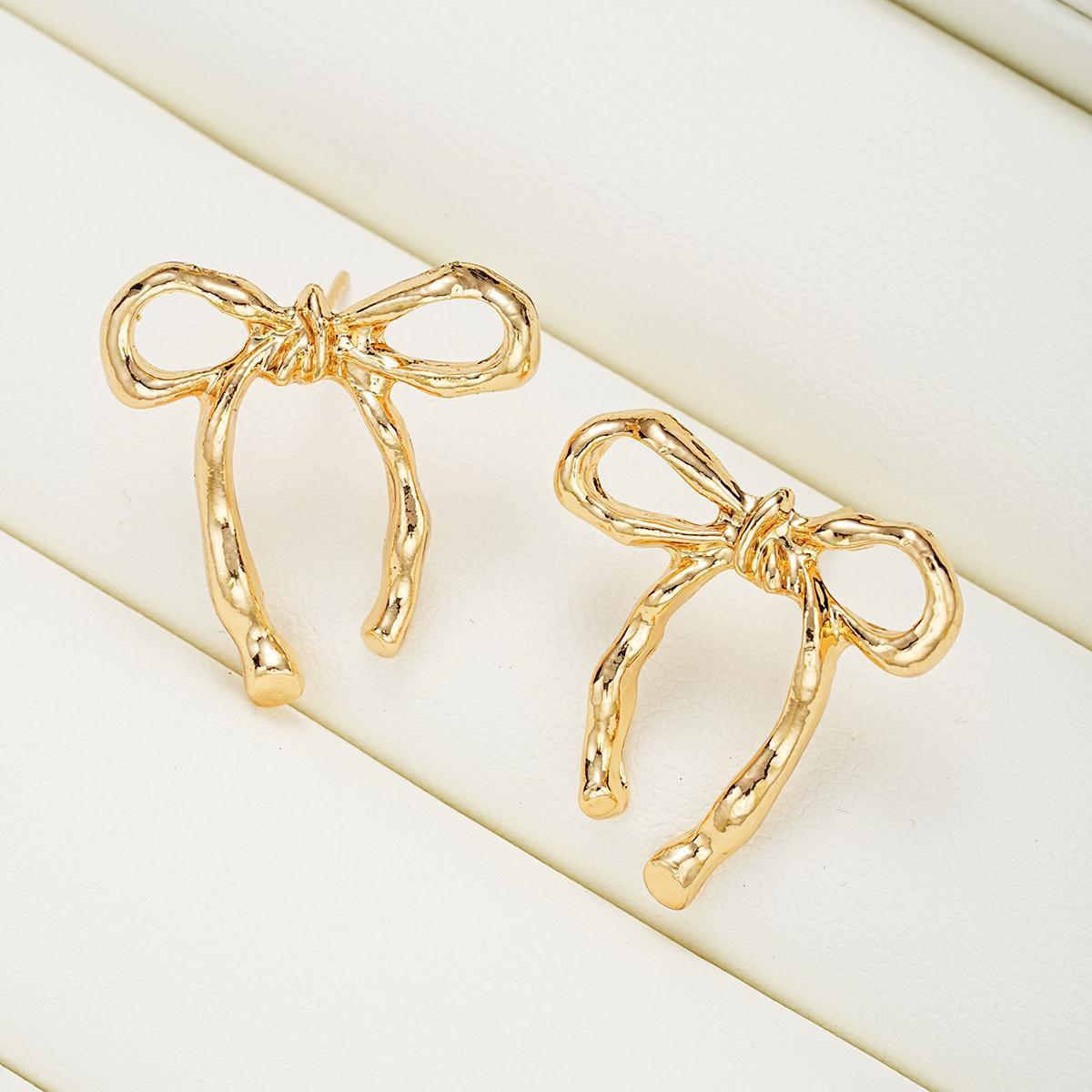 Hollowed-out bow earrings, women's stud earrings, simple and unique earrings, minimalist retro butterfly earrings.