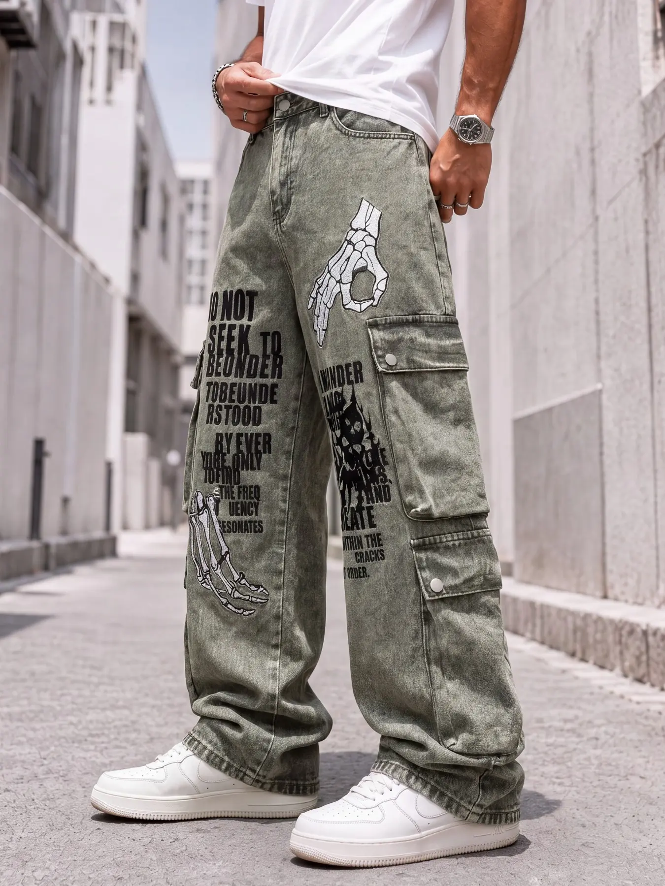 Men's loose cargo denim pants, featuring a multi-pocket design and skeleton arm graffiti print, suitable for everyday street outings