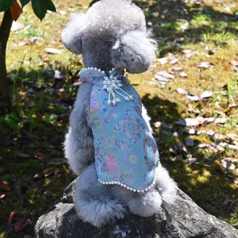 Paws Trendy Pet Spring & Summer Qipao for Dogs & Cats, suitable for Teddy, Bichon Frise and other small dogs. Features embossed fabric with exquisite retro frog buttons, fine workmanship, exuding noble elegance and making your beloved pet stand out.