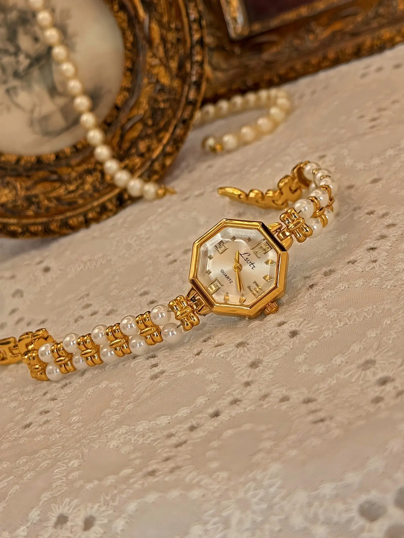 1 new gold upscale elegant ladies quartz analog watch gold case white dial with double-row pearl bracelet low-key elegant ladies waterproof watch.