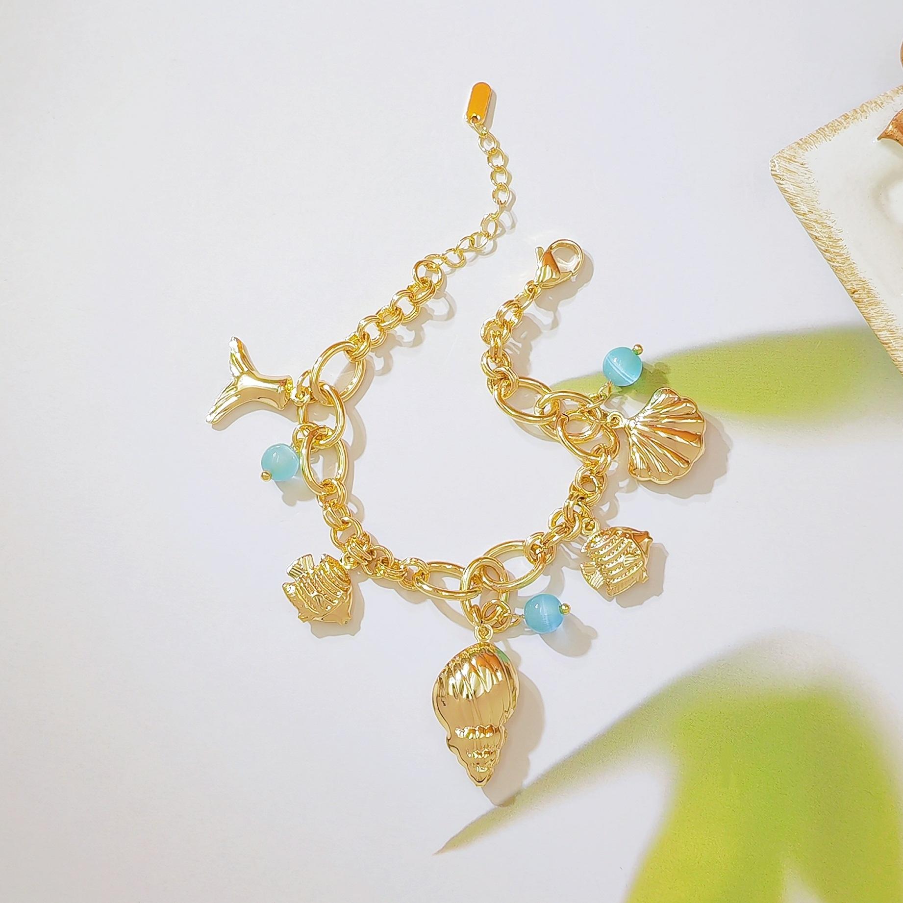 18K Gold Plated Ocean Inspired Bracelet with Shell Conch Mermaid Tail and Blue Cat Eye Stone Minimalist Stylish Design for Daily Wear