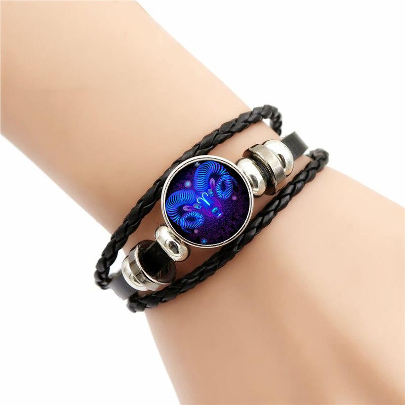 Zodiac Energy Bracelet - A black leather wrap bracelet featuring a glow-in-the-dark design that radiates positive energy.