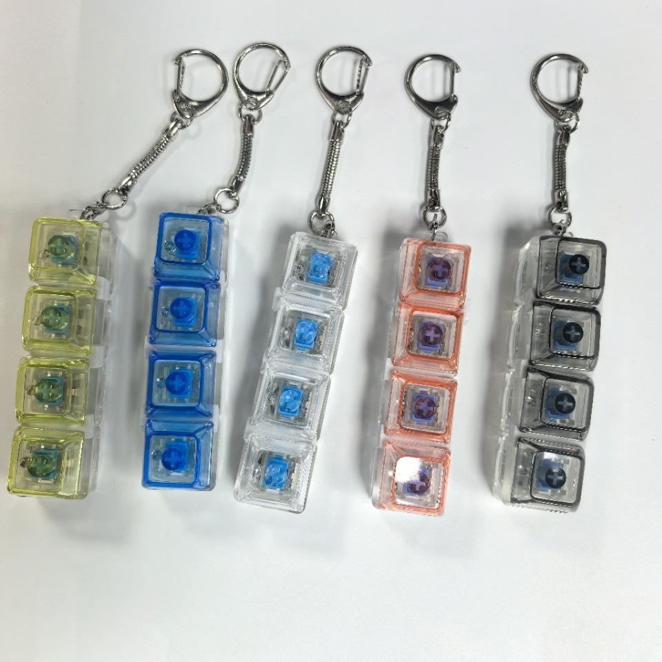 4-key decompression button, Russian Tetris keychain, mechanical key with light-emitting function, stress-reducing fingertip toy key.