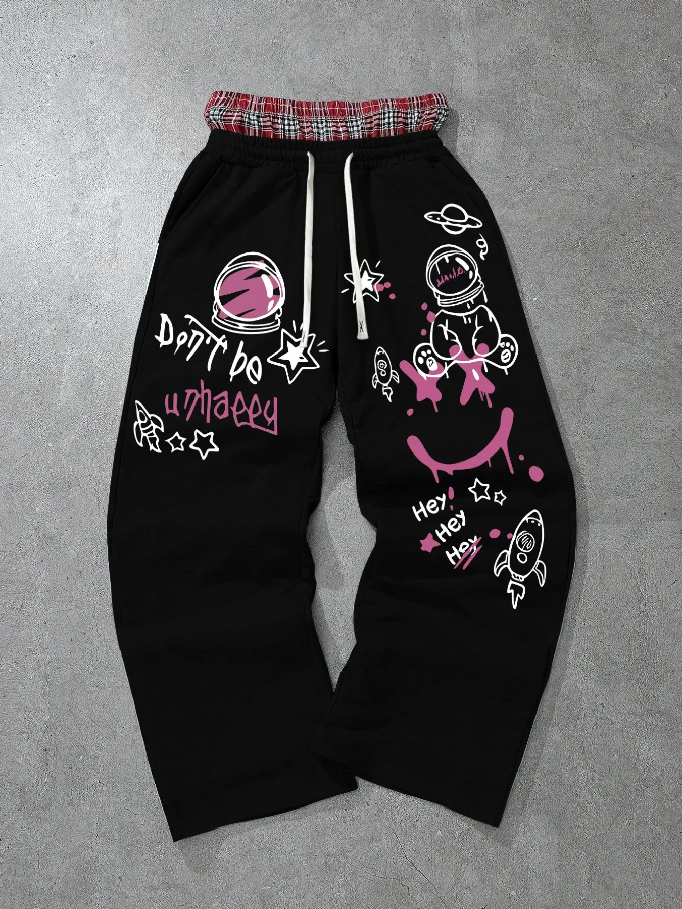 Unisex Y2K Graffiti Astronaut Wide Leg Pants, Dual Layer Plaid Waistband, Elastic Drawstring Side Pockets, Cartoon Print Loose Fit, Multiple Colors Available
