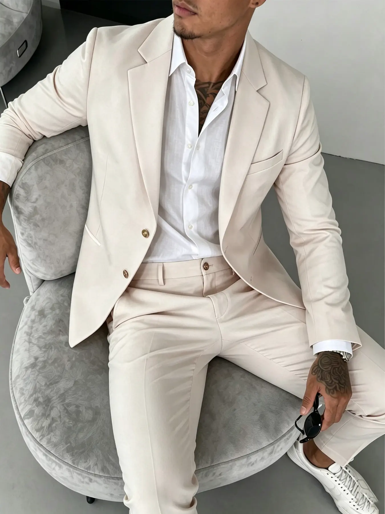 Men's suit set featuring a minimalist, high-end, and stylish design with a slim, structured fit; suitable for various occasions, including business meetings, social gatherings, dates, and weddings.