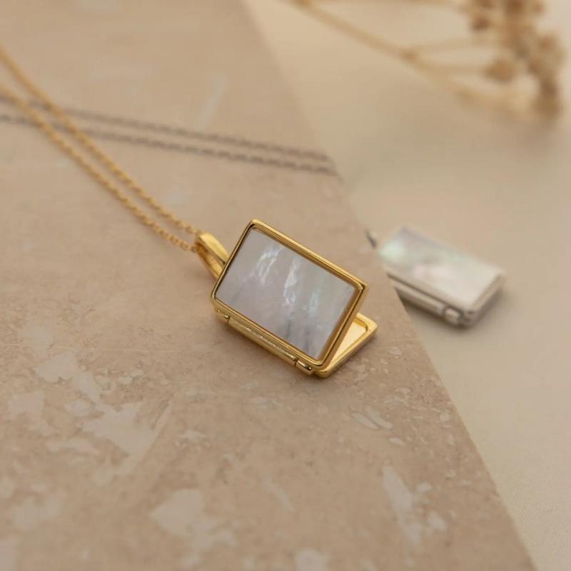 Pearl Locket Necklace by Caitlyn Minimalist.