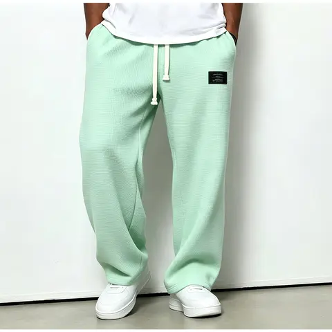 Men's Solid-Color Drawstring Pants with Curved Blade Design—Casual comfort, relaxed fit suitable for all seasons. Street-style men's trousers perfect for everyday wear and layering. Menswear Beige daily wear pant