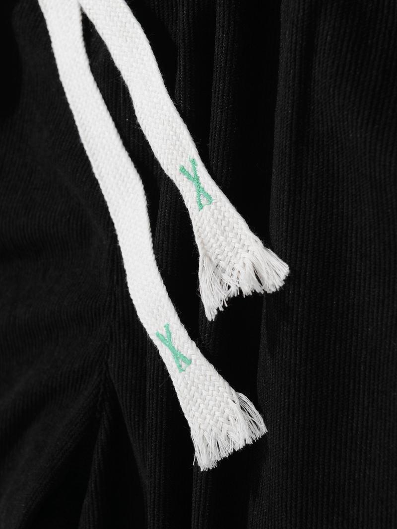 Two men's casual pants featuring a simple and versatile style with drawstring design, adding a casual feel. The pants have delicate small details, making them full of texture. The loose fit provides comfortable and relaxed wear, suitable for everyday outi