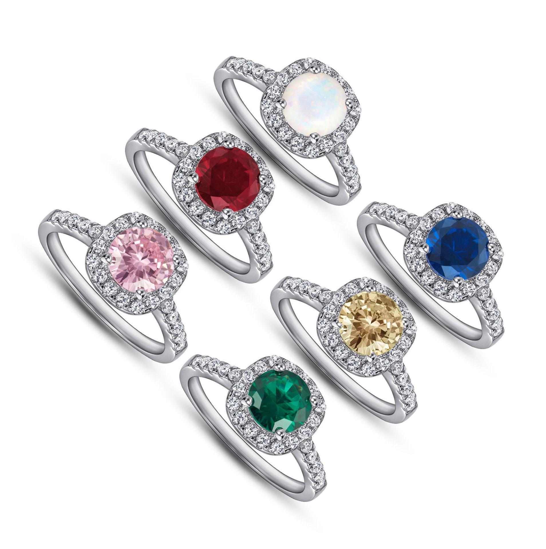 A large gemstone ring set with opal, emerald, ruby, garnet, sapphire, topaz, and crystal colored stones, crafted from s925 sterling silver, suitable for gifting, holidays, balls, and parties A large gemstone ring set with opal, emerald, ruby, garnet, sapphire, topaz, and crystal colored stones, crafted from s925 sterling silver, suitable for gifting, holidays, balls, and parties