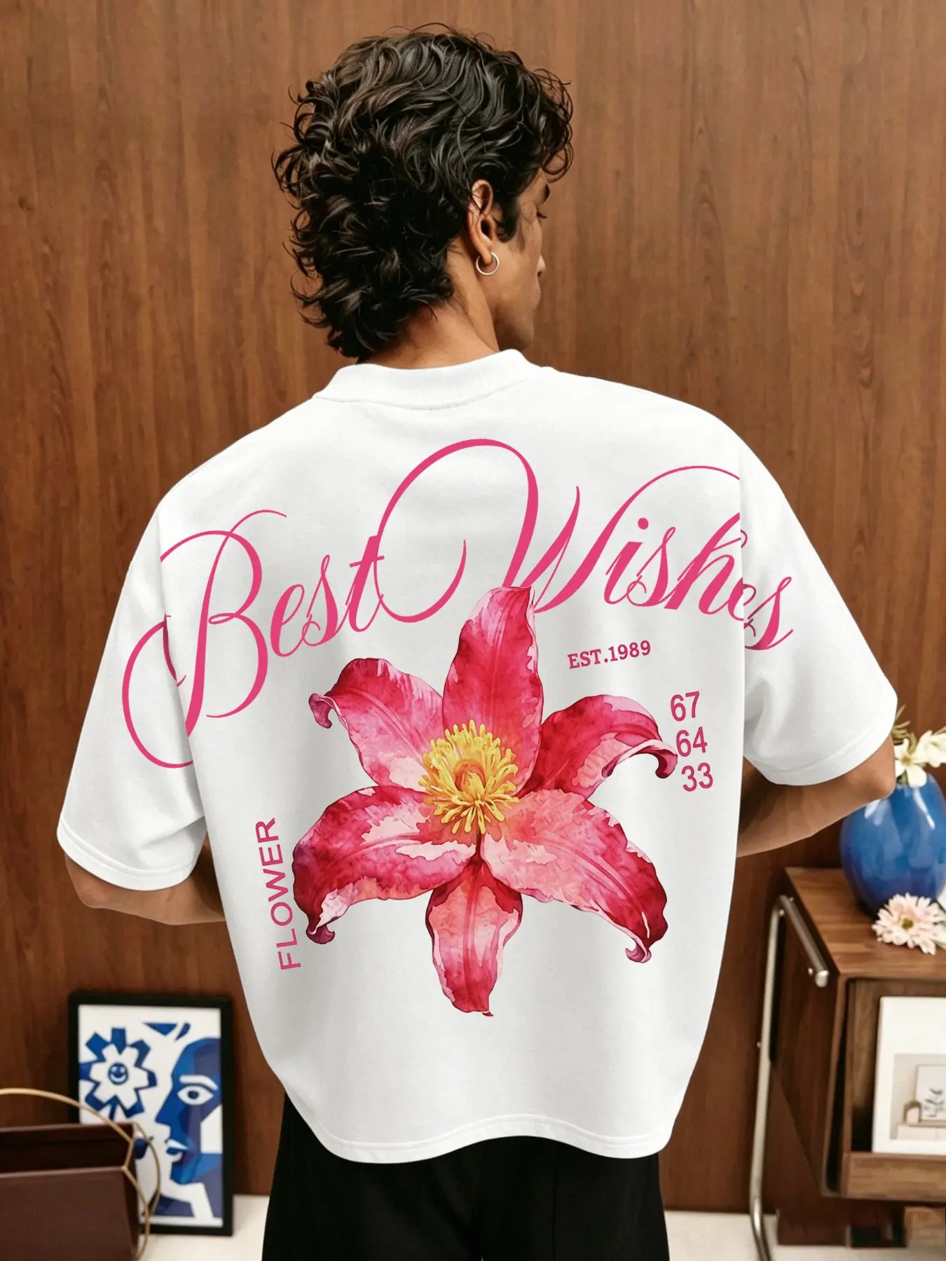Men's short-sleeve top featuring a cropped fit and raglan batwing sleeves, highlighted by a bold, oversized floral pattern that extends across the shoulders; suitable for various occasions, including back-to-school, vacations, and everyday wear.