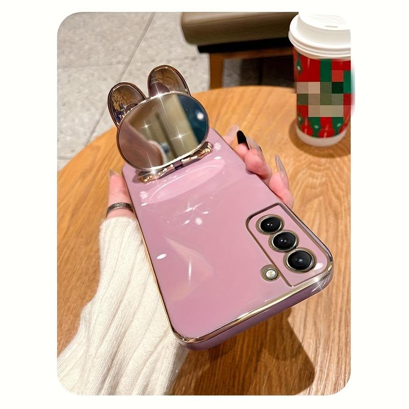 New rabbit-shaped adhesive phone stand with makeup mirror is suitable for iPhone, Samsung, Xiaomi phones, and various other phones. The rabbit phone case desktop stand is a hollow-out lazy stand