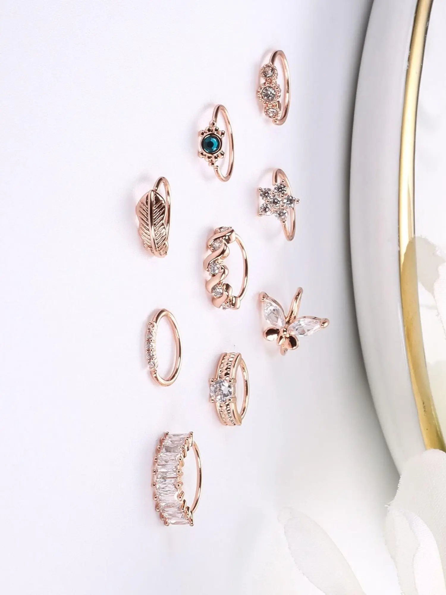 Assorted Copper Nose Piercing Jewelry Set, 9 Pcs Rose Golden Open C‑Shaped Nose Stud Rings, Nose Rings Hoops, Multi‑Hue CZ Zircon Inlay, Feather, Floral, Twisted & Stacked Band Motifs, Adjustable Nostril Piercing Ornaments for Women Men
