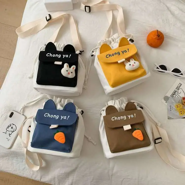 Cute Bunny Ear Canvas Crossbody Bag for Teen Girls, Mini Drawstring Purse with 3D Plush Rabbit Doll, Double Layer Closure & Adjustable Strap